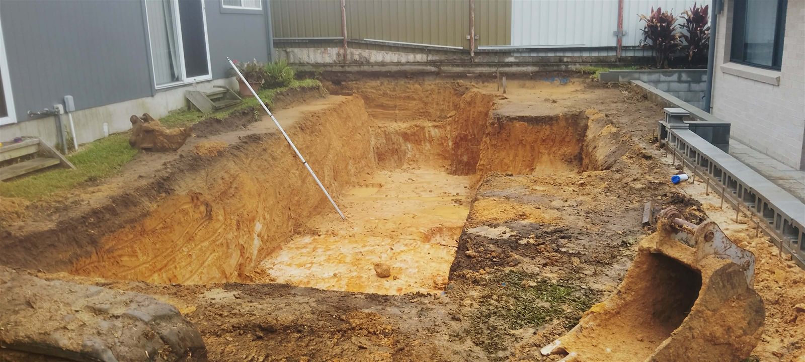 Deep residential foundation excavation beside a home in Lake Macquarie