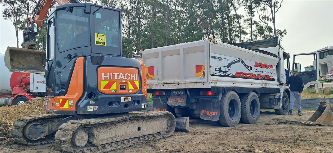 Sabo's Down to Earth Excavation machinery on a residential earthworks site